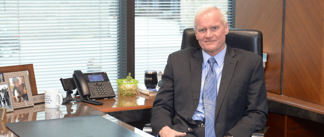 Tom Beck at his desk