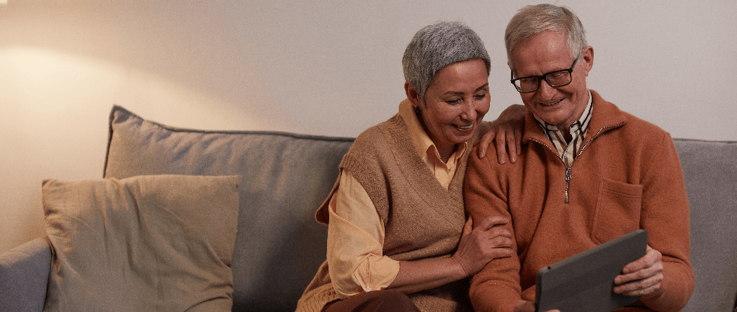 Two people looking at tablet